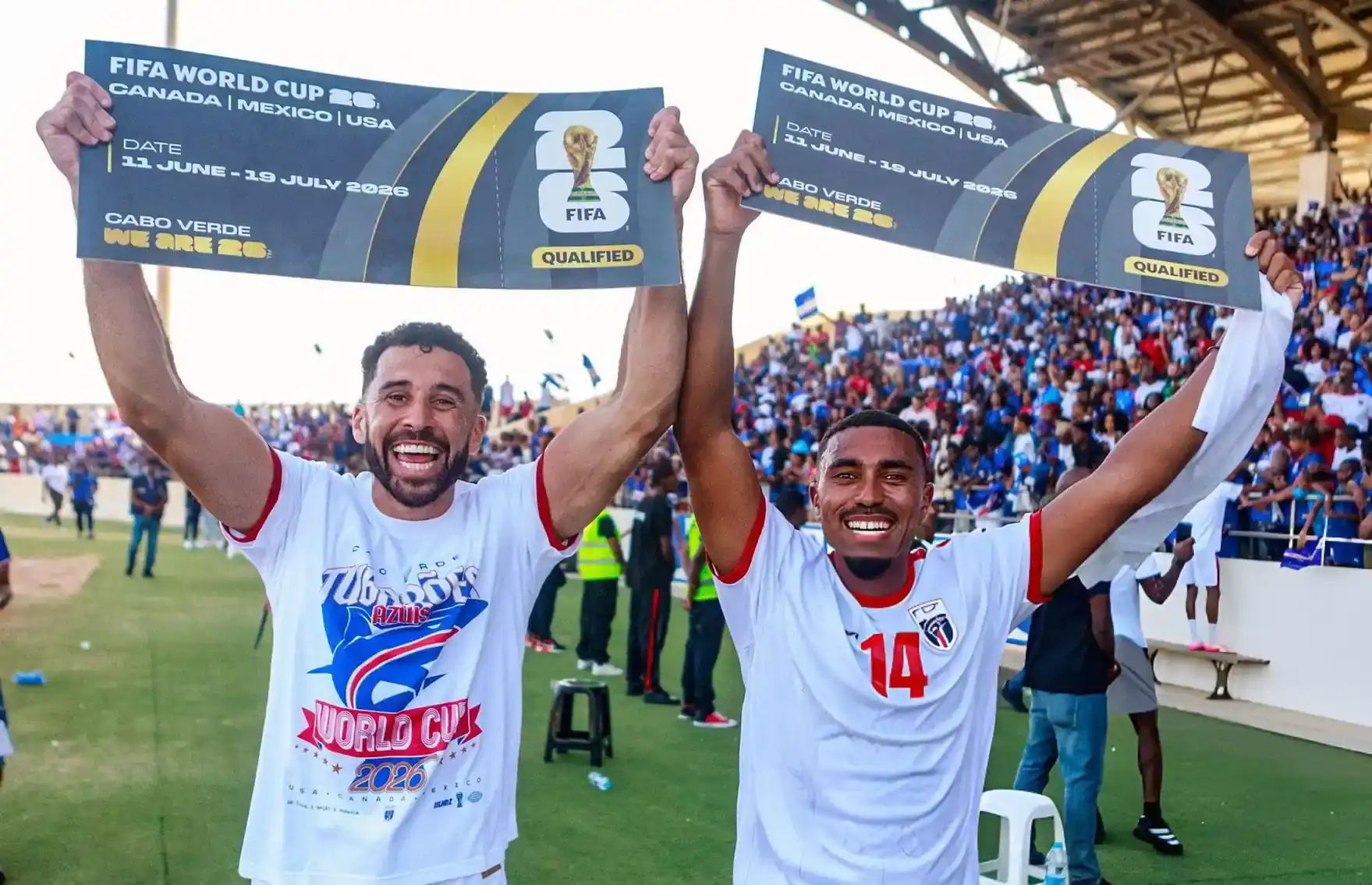 Supporters celebrating a major qualification milestone at a stadium